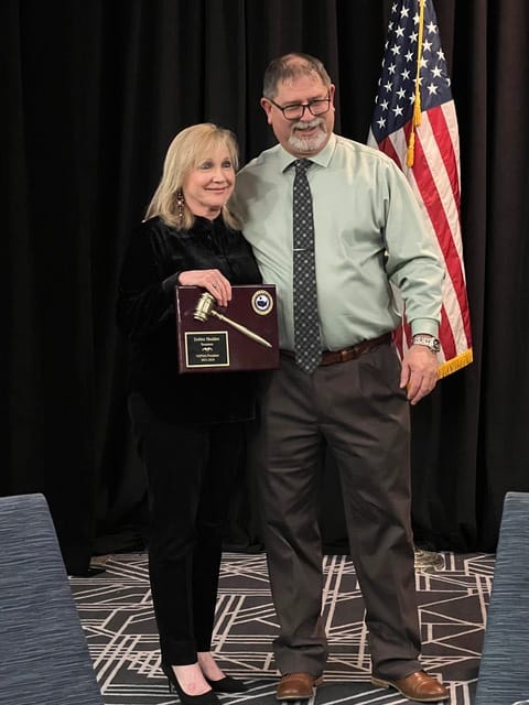 Debbie Shedden, receiving the 2024 NSPMA Past-President Award from Shawn Dilday, NSPMA President.